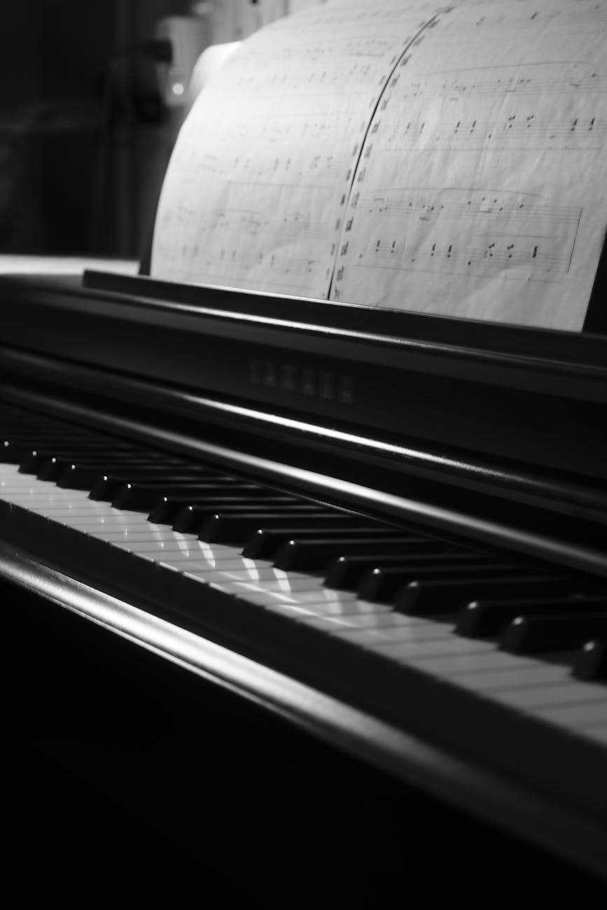 grayscale photo of a piano