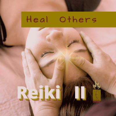 Image of a woman's face receiving a Reiki treatment from the view with the caption Reiki II Class and the Emerge Guided Healing logo.